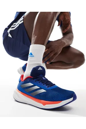 adidas Adidas Running Supernova Stride trainers in and orange