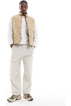 Lee Reversible western puffer vest in beige/tan
