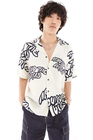 Dr Denim Madi short sleeve relaxed fit summer shirt with navy graphics in ecru exclusive to ASOS