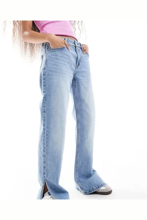 Bershka Petite split hem flare jean in light wash