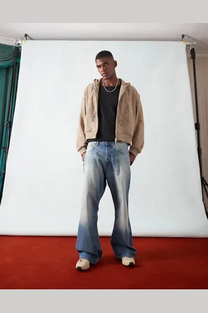 Weekday Time loose fit bootcut jeans in streaky wash