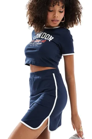 Pieces® Sport Core mini skirt co-ord with contrast trim in and white