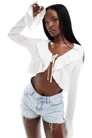 Aria Cove Linen blend ruffle tie detail top in