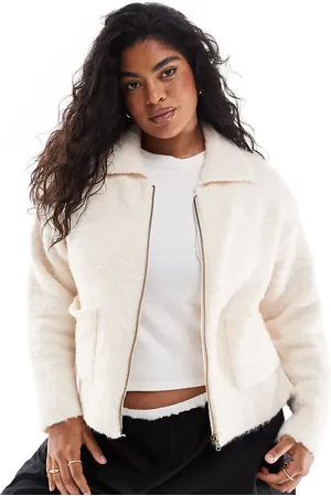 In The Style Knitted zip through pocket detail cardigan in cream