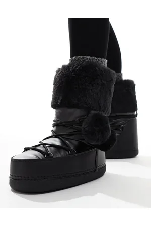 Public Desire Aster snowboots with with fur trim and pom pom detail in