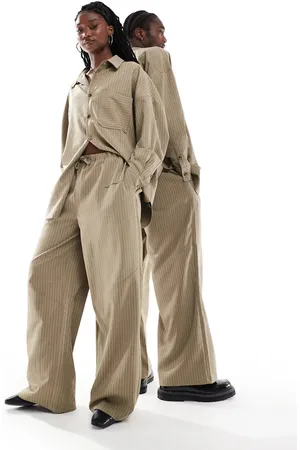 COLLUSION Unisex co-ord balloon trousers in pinstripe with print