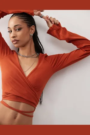 Monki Wrapped rib yoga cardigan with tie details in rust