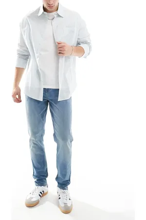 ASOS Skinny jeans with yellow tint in mid wash