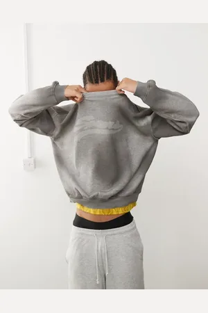 Weekday Liam oversized sweatshirt with faded graphic print and frayed seam details in spray wash