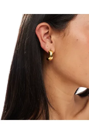 Accessorize Z stainless steel plated molten cresent hoops in