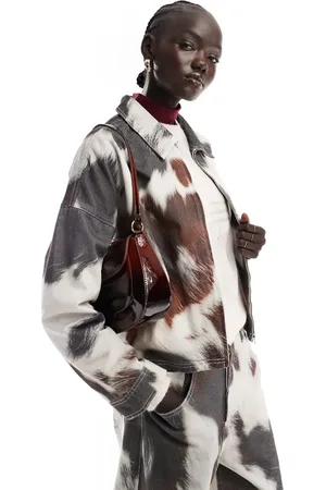 ASOS Denim clean collared jacket in cow print