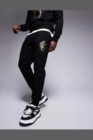 Armani Exchange Lunar capsule snake joggers in