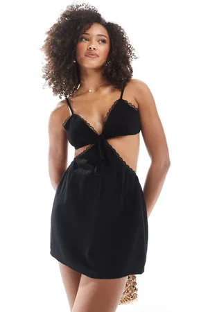 The Frolic Exclusive linen blend v neck cut out lace trim mini beach dress in