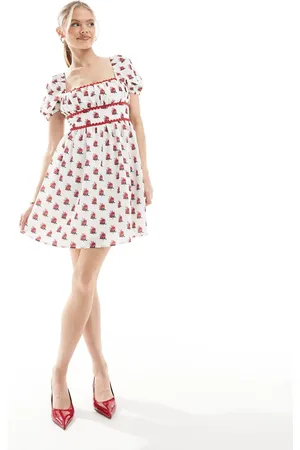 The Frolic Exclusive scallop trim square neck puff sleeve bow tie back mini dress in cream floral