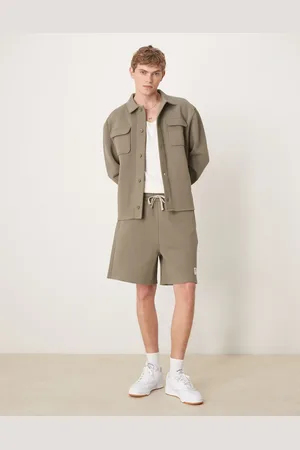 ASOS Oversized co-ord short with woven patch and raw edge in khaki