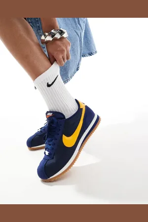 Nike Cortez trainers in and yellow
