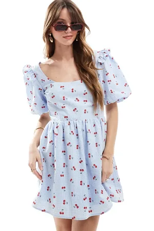 The Frolic Exclusive seersucker ruffle puff sleeve shirred babydoll mini dress in check and cherry print