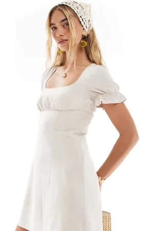 The Frolic Exclusive linen blend square neck lace trim tie back puff sleeve mini dress in stone