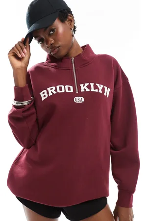 Daisy Street Quarter zip sweatshirt in burgundy with large collegiate graphic