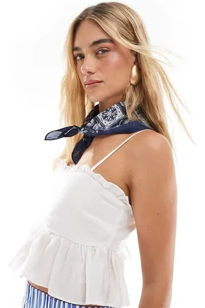 The Frolic Exclusive ruffle trim tie back babydoll cami top in