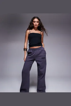 Kaiia Petite embroidered logo wide leg joggers in dark