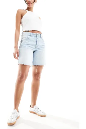 Bershka High waisted raw hem longline denim shorts in light wash