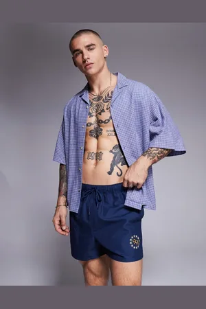 ASOS Swim shorts in short length with placement print in