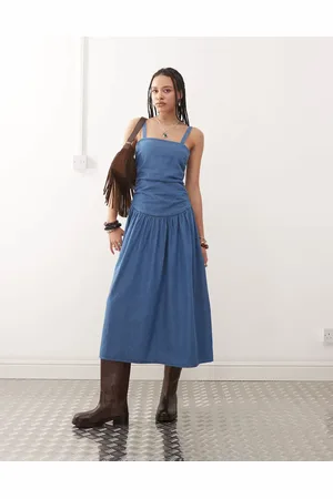Reclaimed Dropped waist gathered detail midi denim dress in authentic midwash - MBLUE