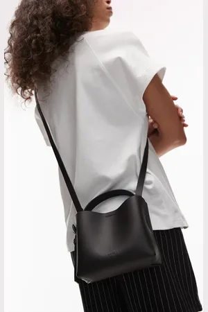 ARKET Small leather cross body tote bag with side buckle detail in