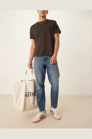 ASOS Tapered fit jeans with vintage tint in light wash