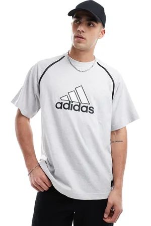 adidas T-shirt in with contrast badge graphic