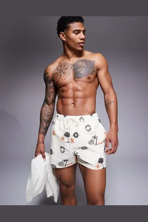 ASOS Seersucker swim shorts in short length with palm tree print in