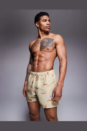 ASOS Swim shorts in short length with beach print in stone