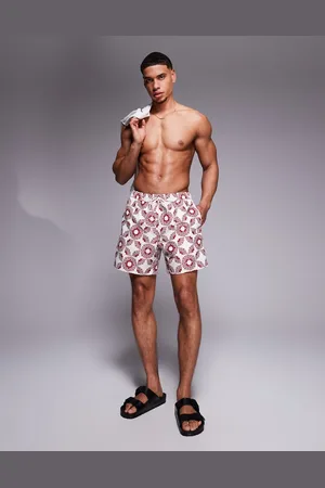 ASOS Swim shorts in mid length with geo print in stone