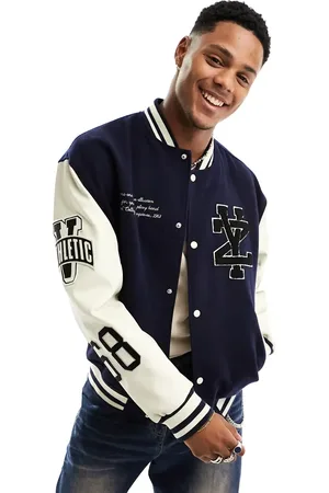 ASOS Oversized varsity bomber jacket in with faux leather sleeves