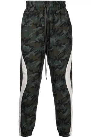 MOSTLY HEARD RARELY SEEN Men Pants - Camouflage-print track pants