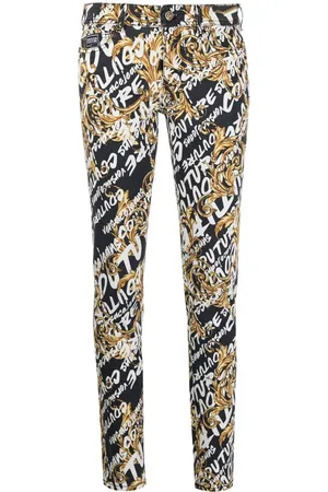 VERSACE Logo-print denim jeans