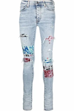 AMIRI Distressed skinny jeans