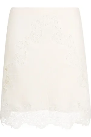 Chloé Ribbed-knit lace-trim miniskirt