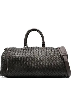 Officine creative Logo-embossed interwoven leather holdall