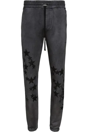 AMIRI Pigment Spray Star track pants