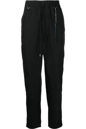 MASTERMIND Logo-print tapered-leg trousers