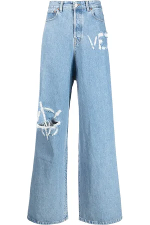 Vetements Logo-distressed baggy jeans