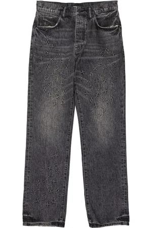 Purple Brand Monogram-embossed jeans