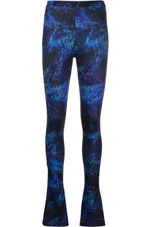 OFF-WHITE All-over logo-print flared trousers