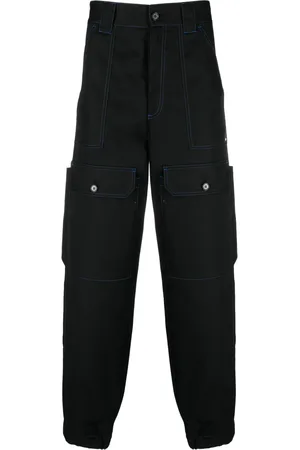 Msgm Contrasting-stitch logo-patch trousers