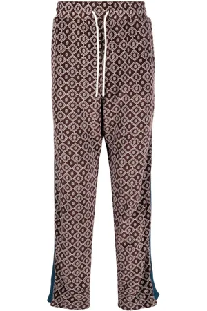 Drôle de Monsieur Monogram-pattern velvet track pants