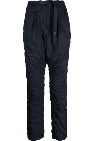 UNDERCOVER Logo-tag buckle-fastening tapered trousers
