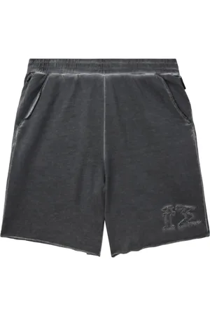 Izzue Distressed cotton track shorts