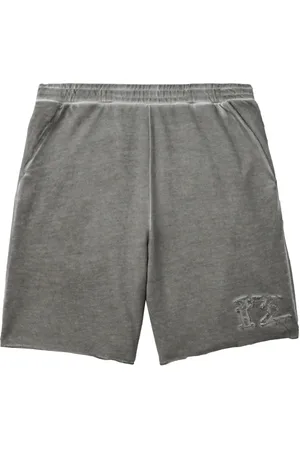 Izzue Distressed cotton track shorts